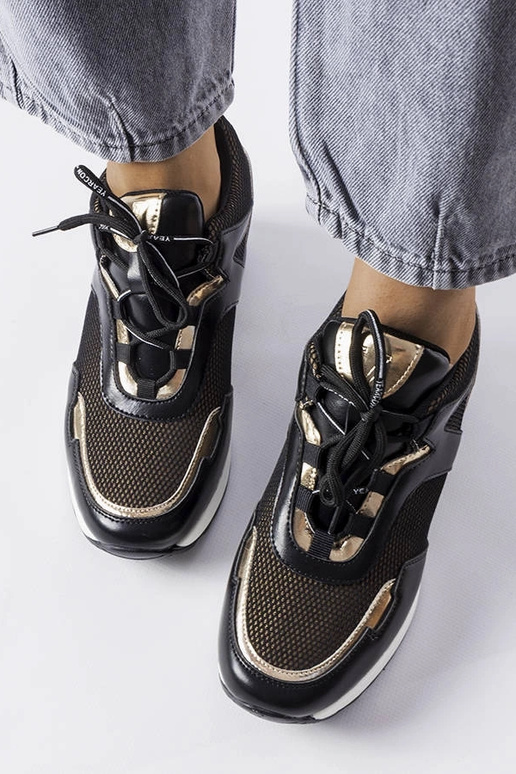 Schwarz-goldene Sportschuhe mit... Schwarz-goldene Sportschuhe mit...
