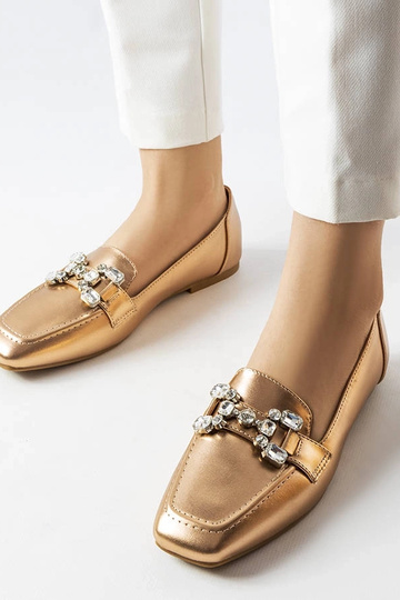 Mocassins en or rose avec...