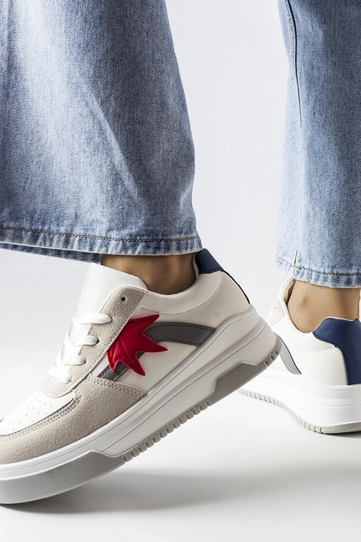 Witte sportschoenen met een... Witte sportschoenen met een...