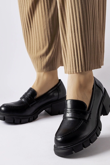 Sorte klassiske loafers på...