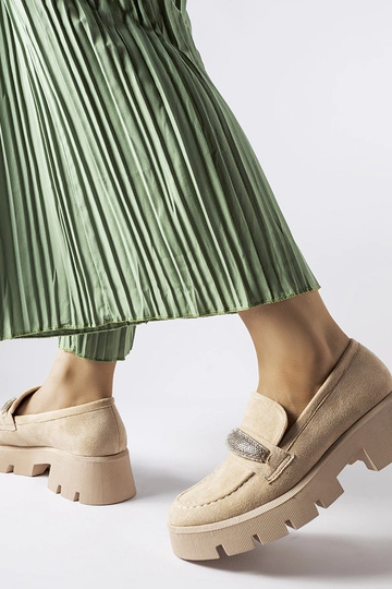 Beige mokkasiner med en... 2