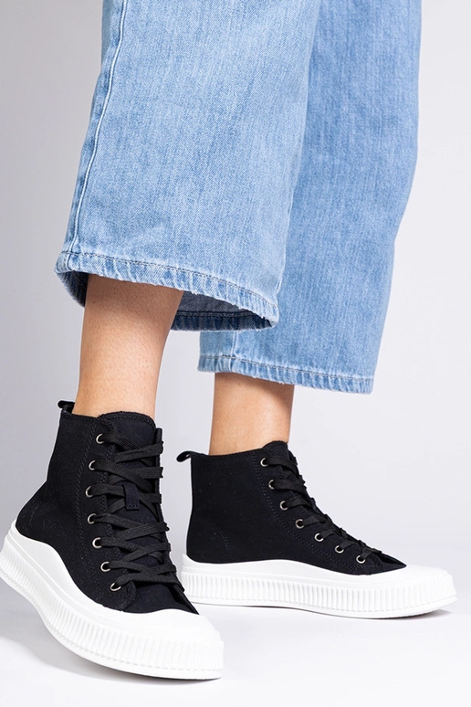 Schwarze hohe Schuhe auf Plattform,...