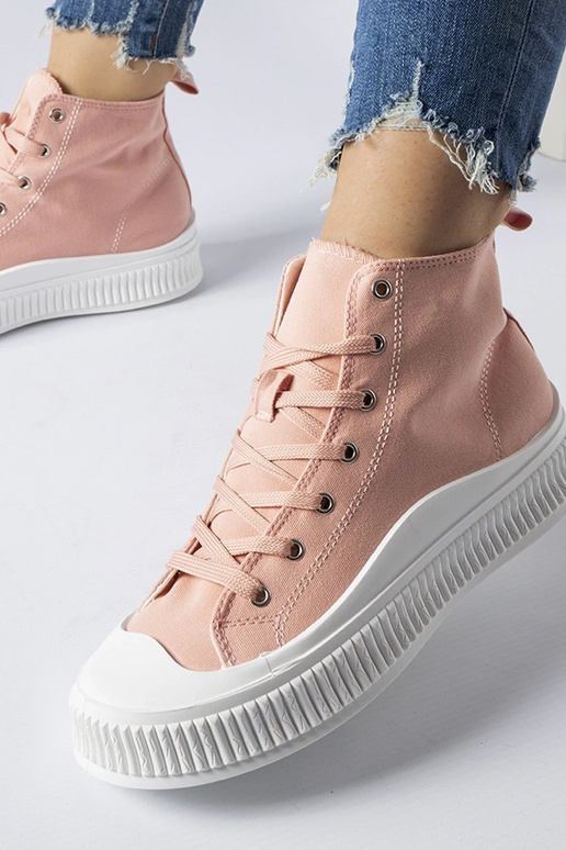 Roze hoge schoenen op een platform,...