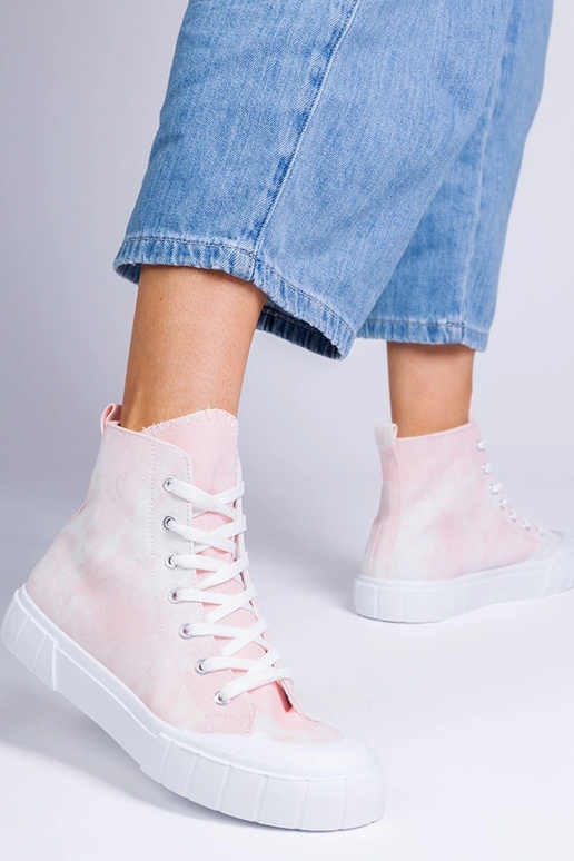 Bottines roses au-dessus de la...