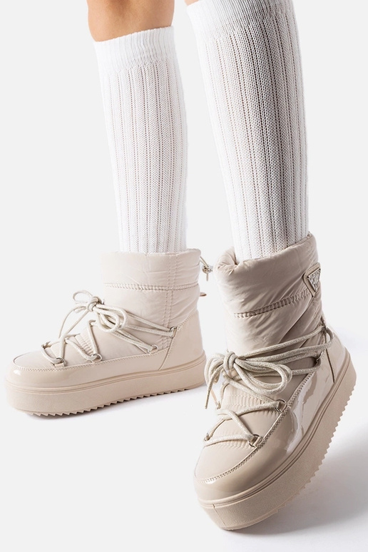 Bottes de neige isolées beiges avec...