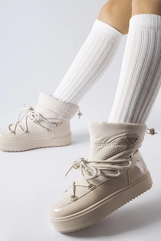 Bottes de neige isolées beiges avec...