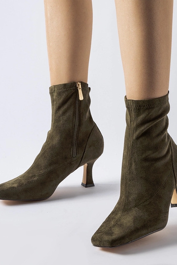 Bottines vertes à talon bas...