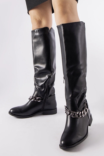 Bottes noires isolées avec...