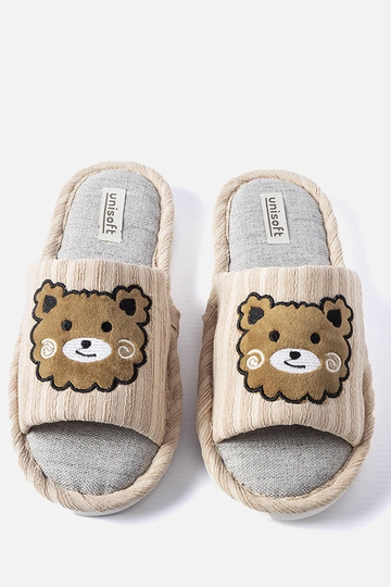 Chaussons beiges décorés du... 2