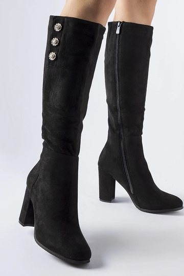 Bottes noires ornées de...