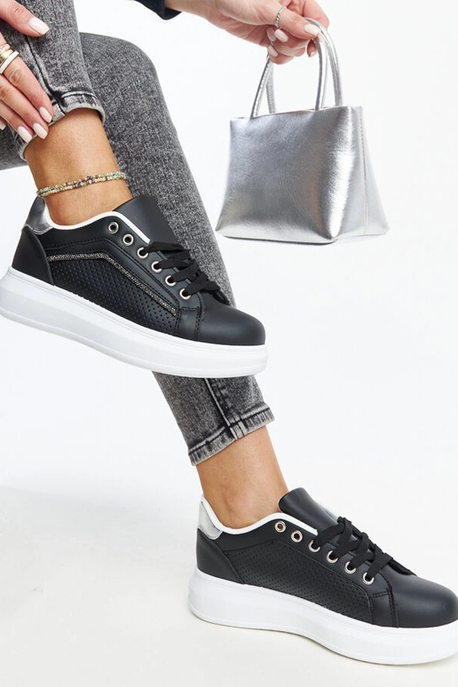 Sorte sneakers med dekorative...
