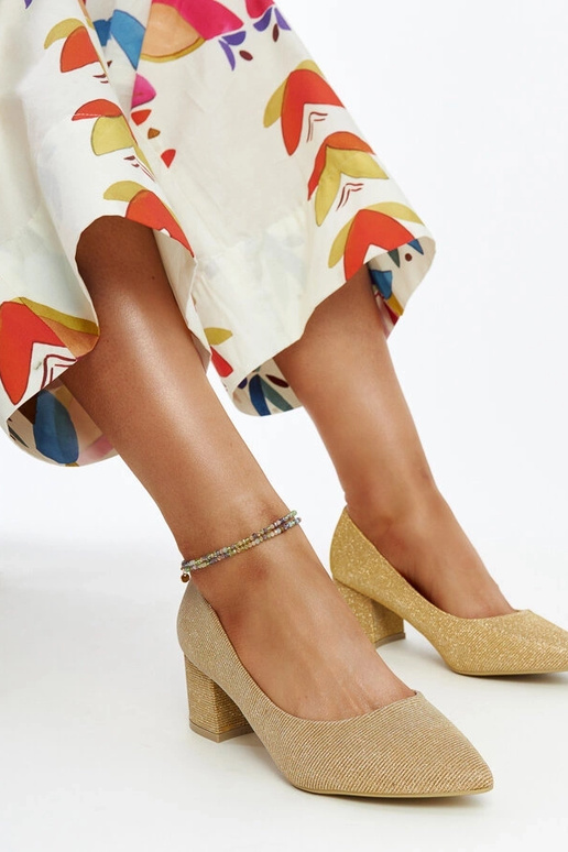 Ballerines à talon dorées et...