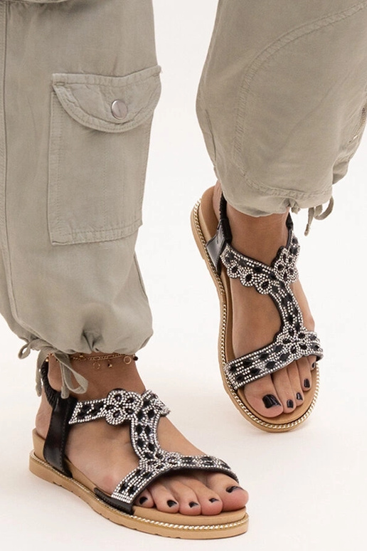 Shahidas skinnende sorte sandaler