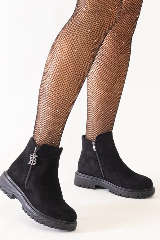 Bottines noires avec pendentif...