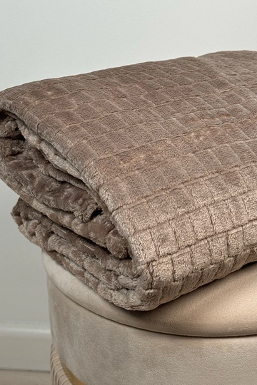 Beige gesteppte Decke