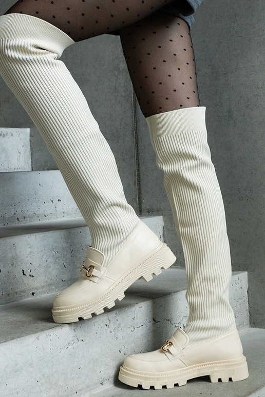 Bottes beige clair avec tige... Bottes beige clair avec tige...