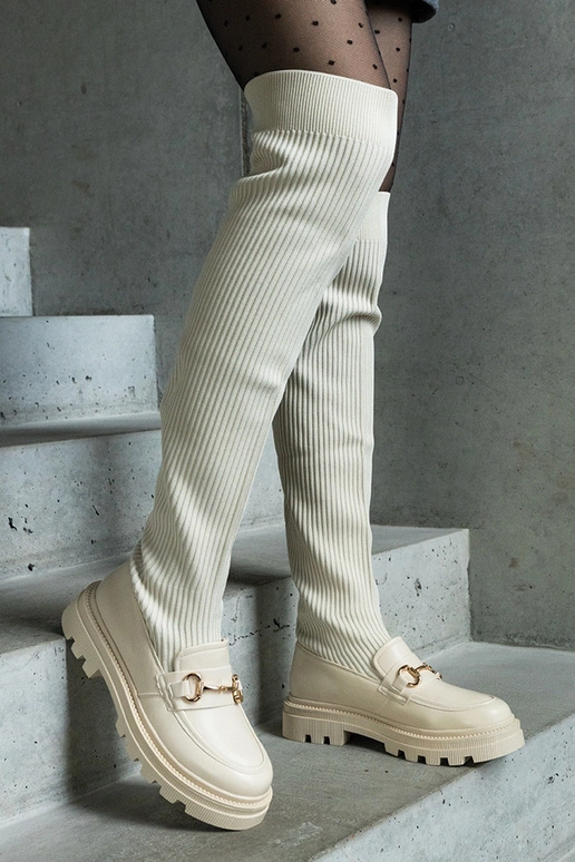 Bottes beige clair avec tige... Bottes beige clair avec tige...