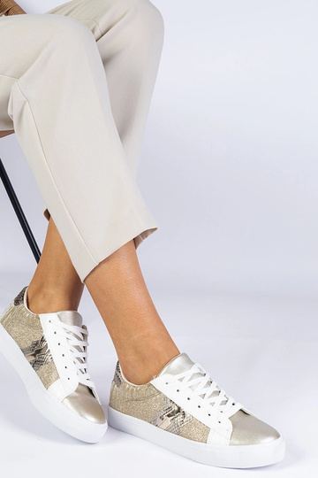 Damesneakers i guld med et...