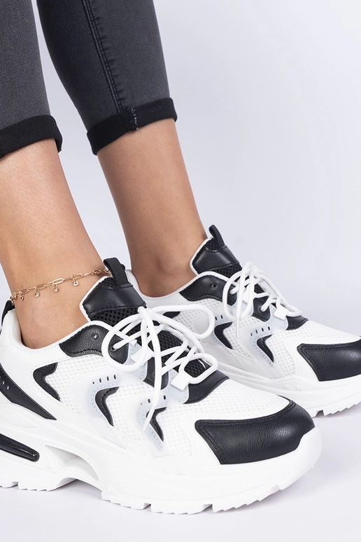 Schwarz-weiße Damen-Sport-Sneakers... Schwarz-weiße Damen-Sport-Sneakers...