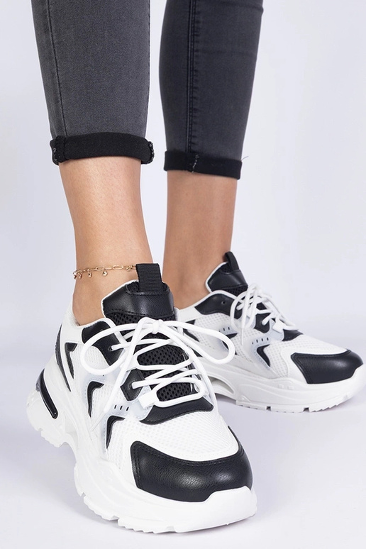 Schwarz-weiße Damen-Sport-Sneakers... Schwarz-weiße Damen-Sport-Sneakers...