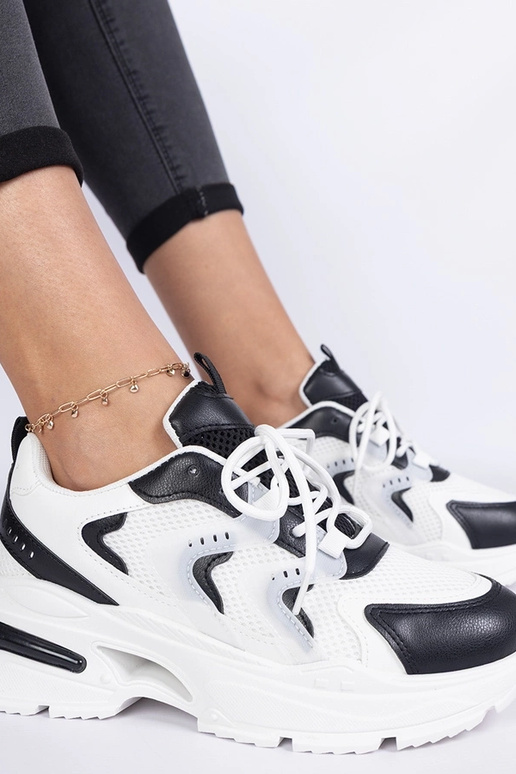 Schwarz-weiße Damen-Sport-Sneakers... Schwarz-weiße Damen-Sport-Sneakers...