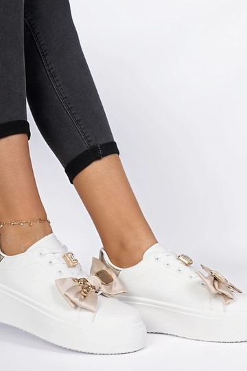 Baskets femme blanc et or...