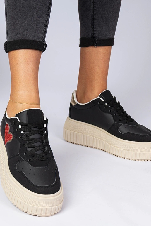 Zwarte dames sneakers met een... Zwarte dames sneakers met een...