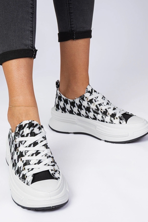 Weiß-schwarze Damen-Sneakers aus... Weiß-schwarze Damen-Sneakers aus...