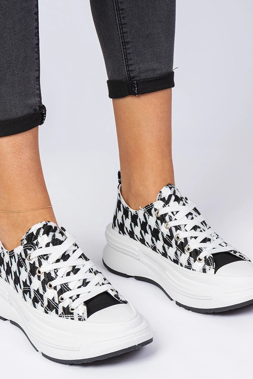 Wit-zwarte dames sneakers van stof... Wit-zwarte dames sneakers van stof...