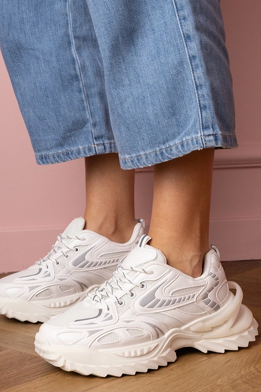 Witte dames sneakers op stijlvolle... Witte dames sneakers op stijlvolle...