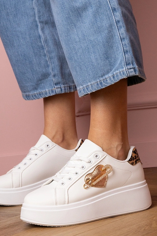 Witte dames sportschoenen met... Witte dames sportschoenen met...