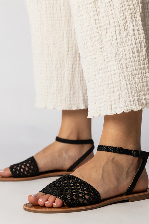 Sandales noires tressées à semelle...