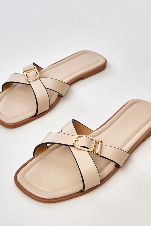 Zandkleurige slippers met decoratieve...