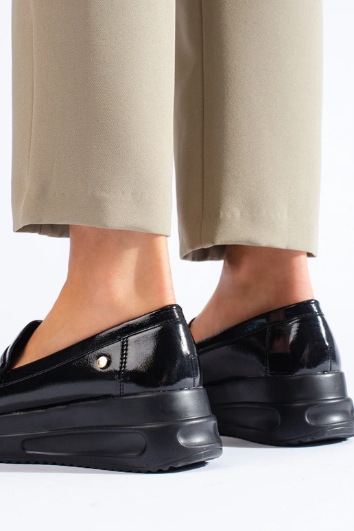 Zwarte mocassins met patenteffect en... Zwarte mocassins met patenteffect en...