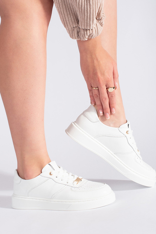 chaussures de sport en cuir blanches...