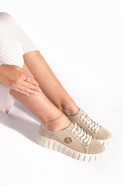 Elfenbeinfarbene Stiefeletten mit...