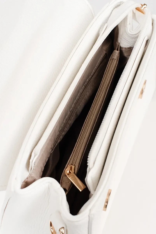 Petit sac blanc avec des éléments dorés