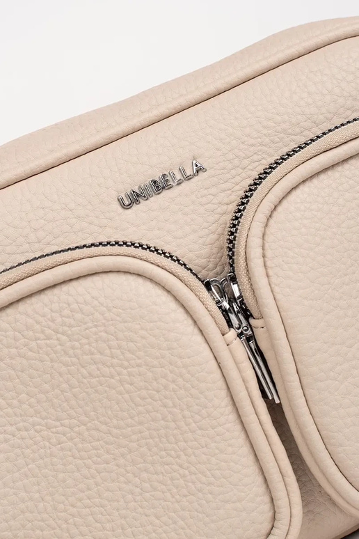 Klein handtasje in ivoorkleur met zakjes