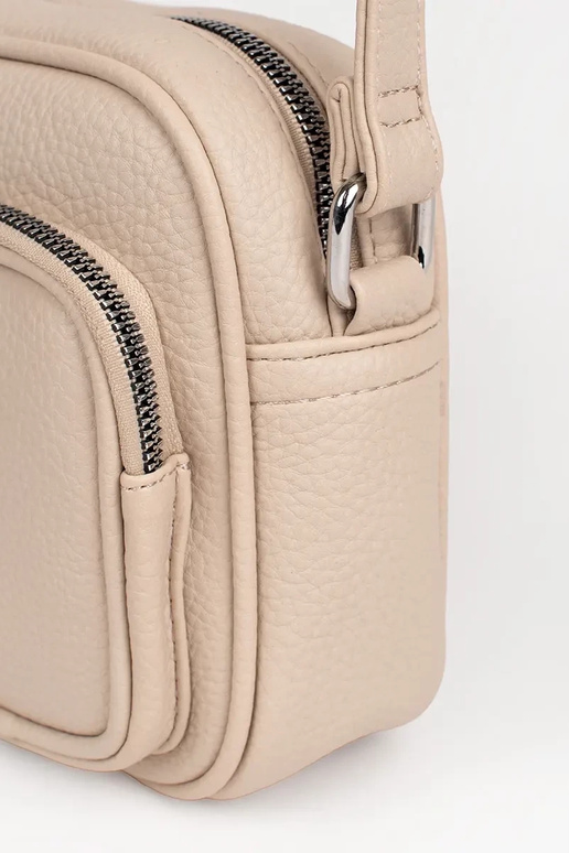 Petit sac en couleur ivoire avec poches