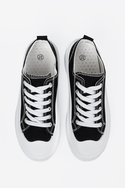 Schwarz-weiße Sneakers mit dicker Sohle Schwarz-weiße Sneakers mit dicker Sohle