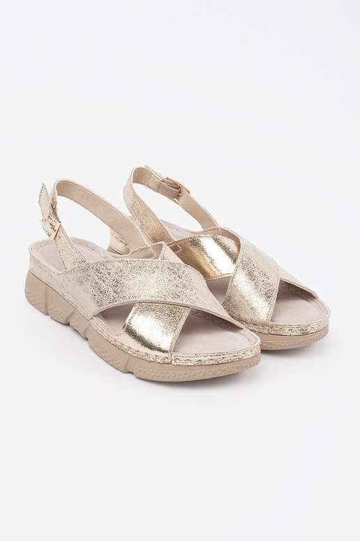 Gouden platte dames sandalen Gouden platte dames sandalen