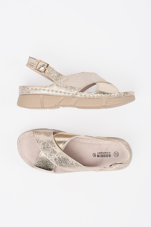 Gouden platte dames sandalen Gouden platte dames sandalen