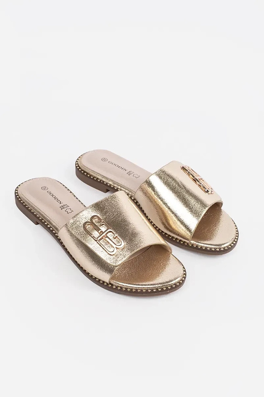 goldene Damenflipflops mit flachem... goldene Damenflipflops mit flachem...
