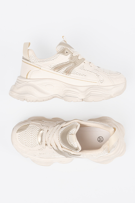 Ivory kleurige sportieve schoenen op...