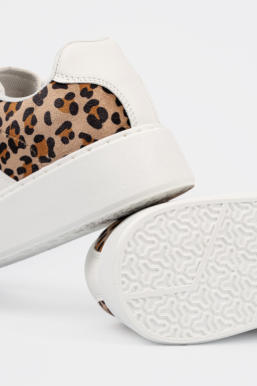 Witte sportschoenen met... Witte sportschoenen met...