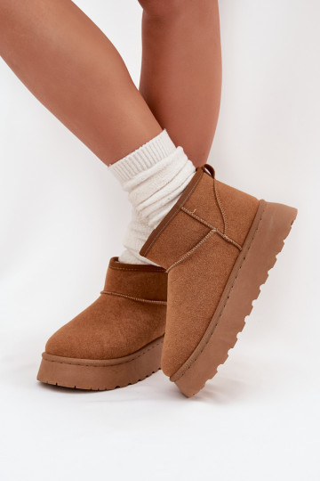 Zandkleurige schoenen met zwarte accenten en een dikke zool 2