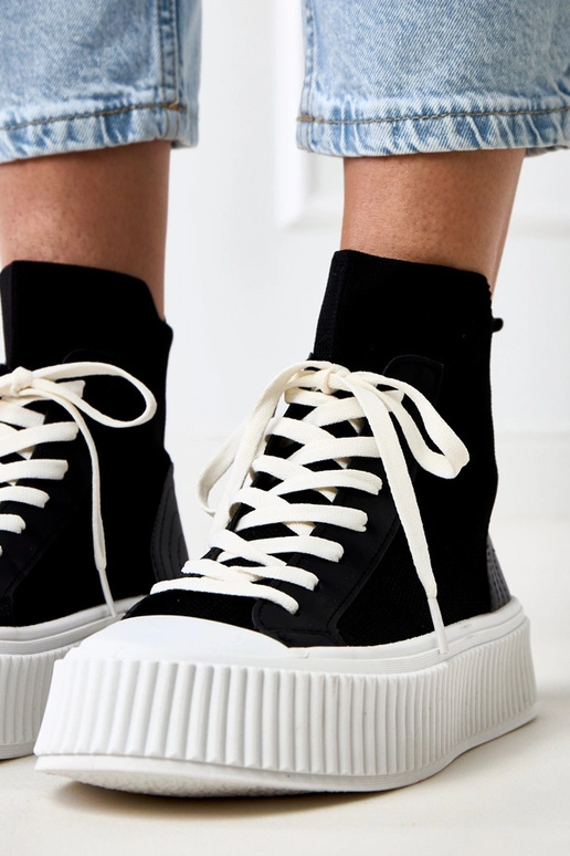 Zwarte instappers in sokkenstijl met... Zwarte instappers in sokkenstijl met...