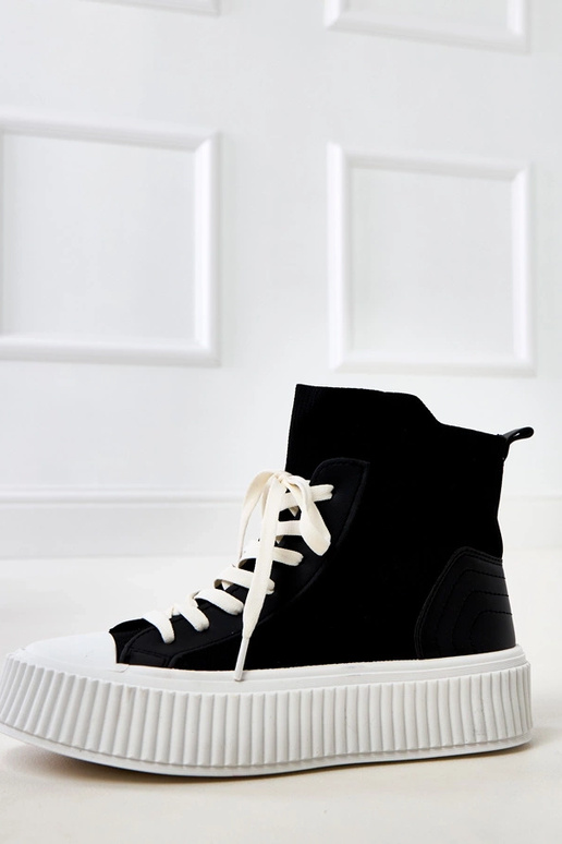 Zwarte instappers in sokkenstijl met... Zwarte instappers in sokkenstijl met...