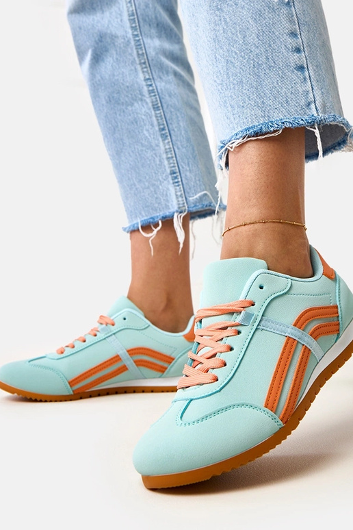 Blaue Sneakers mit orangefarbenem... Blaue Sneakers mit orangefarbenem...