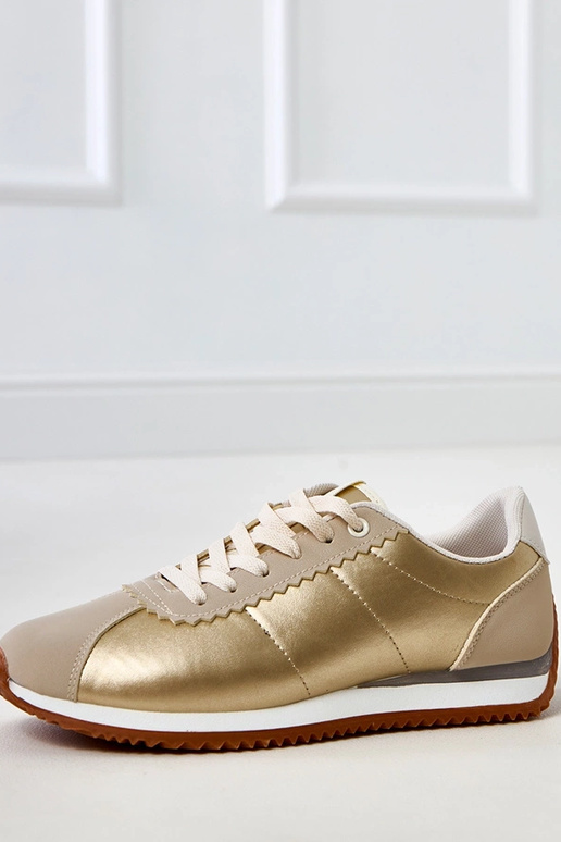 Sandfarbene Sportschuhe mit... Sandfarbene Sportschuhe mit...